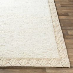 SURYA HAGUE PLUSH WOOL BORDER RUG: CREAM