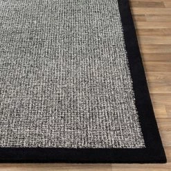 SURYA HAND TUFTED WOOL BORDER RUG: BLACK