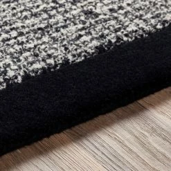 SURYA HAND TUFTED WOOL BORDER RUG: BLACK