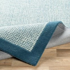 SURYA HAND TUFTED WOOL BORDER RUG: BLUE