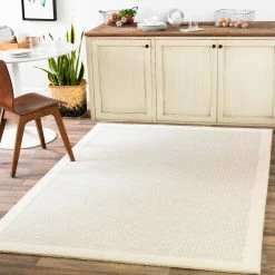 SURYA HAND TUFTED WOOL BORDER RUG: CREAM