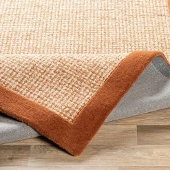 SURYA HAND TUFTED WOOL BORDER RUG: RUST