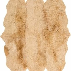 SURYA SHEEPSKIN HIDE RUG: CAMEL